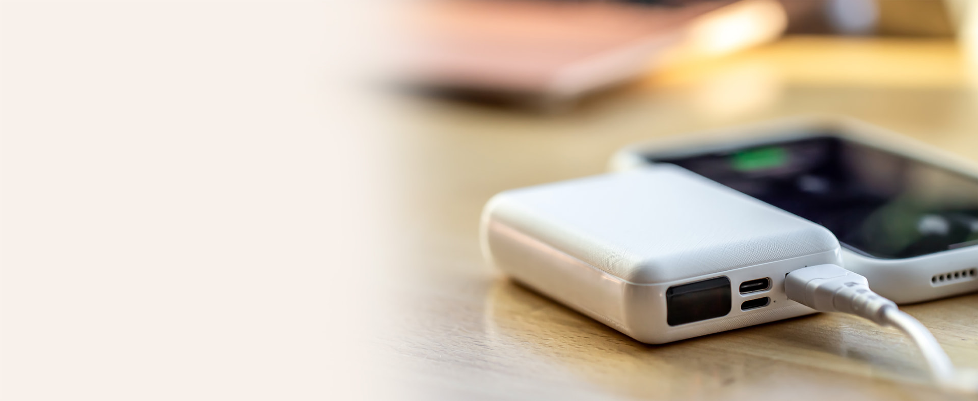 Branded power bank charging a smartphone
